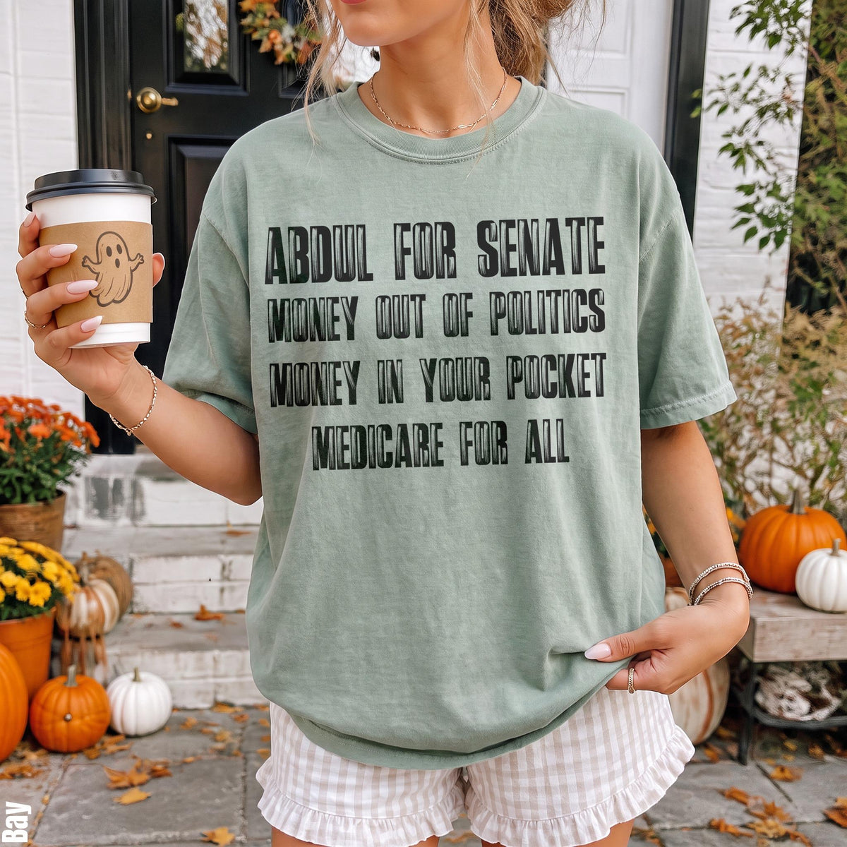 Green t-shirt with text: Abdul for Senate, Money out of Politics, Money in your pocket, Medicare for all.