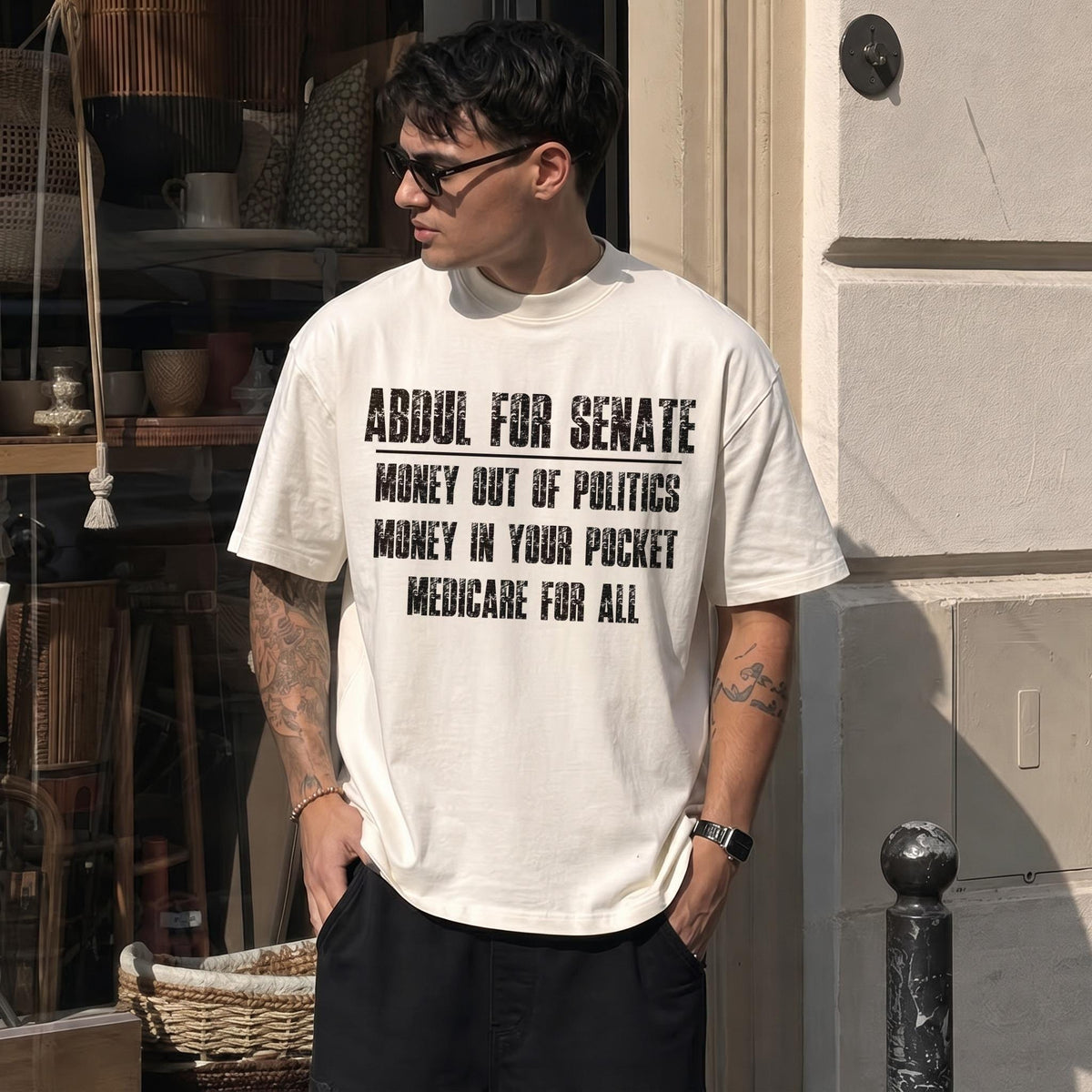 Cream t-shirt with black text: &amp;quot;Abdul for Senate, Money out of politics, Money in your pocket, Medicare for all.&amp;quot;