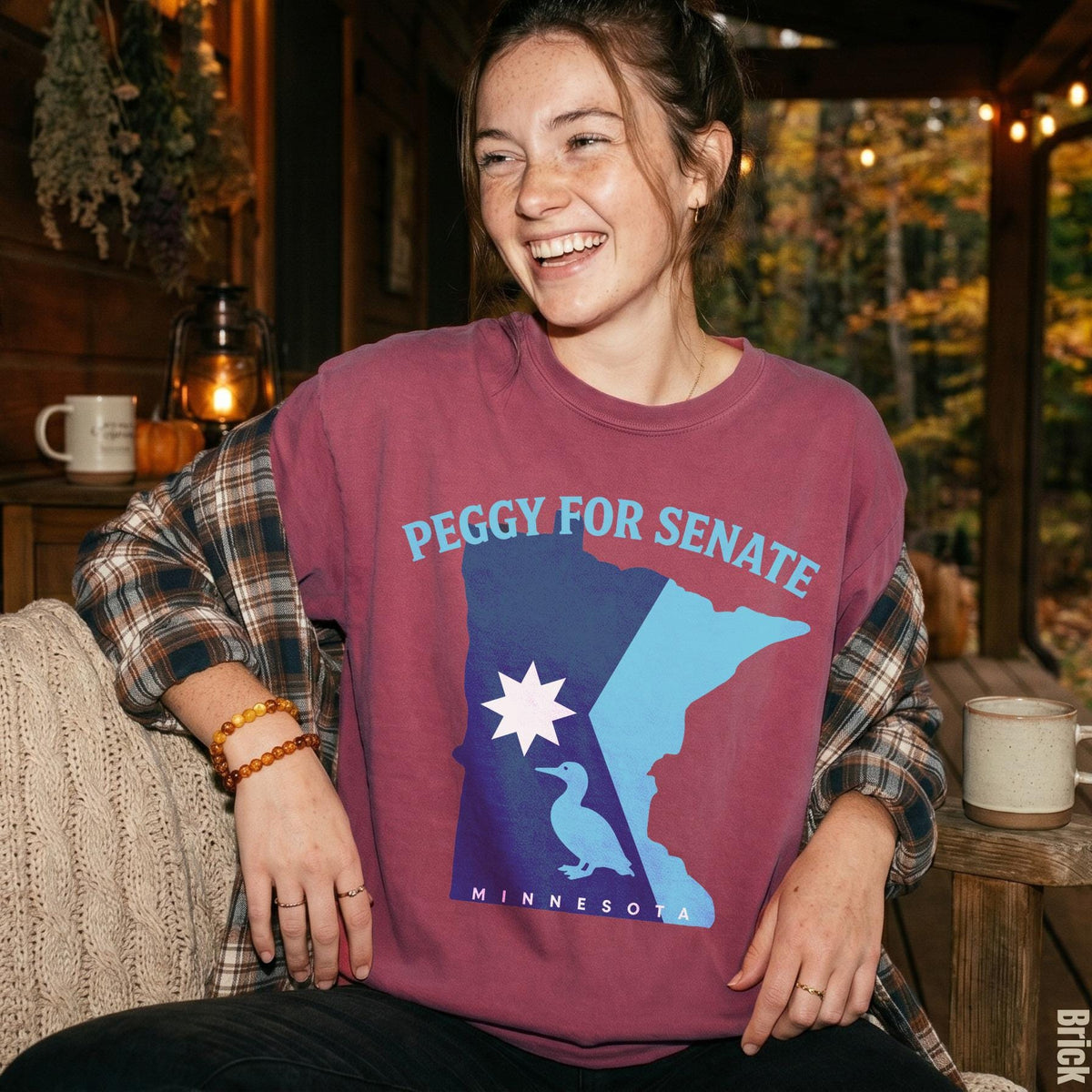Burgundy shirt with &amp;quot;PEGGY FOR SENATE MINNESOTA&amp;quot; and Minnesota outline graphic.