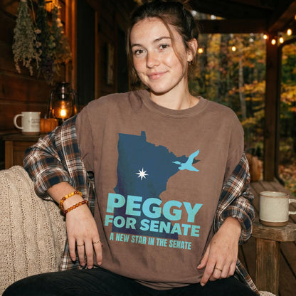 Brown t-shirt with Minnesota map, blue bird, and &amp;quot;PEGGY FOR SENATE&amp;quot; text.