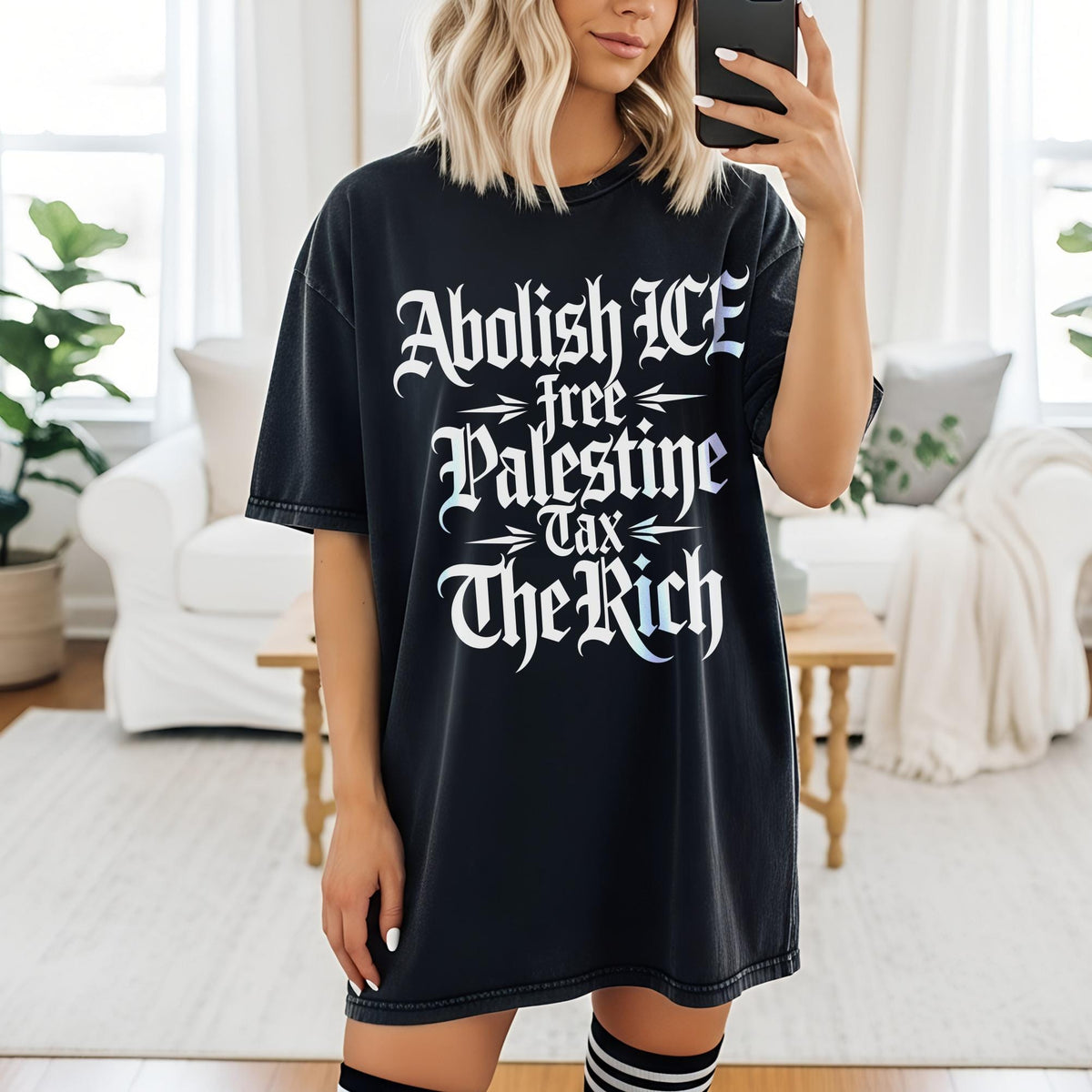 Black t-shirt with white text reading &amp;quot;Abolish ICE, Free Palestine, Tax The Rich&amp;quot;.