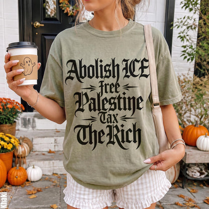 Green t-shirt with text &amp;quot;Abolish ICE free Palestine Tax The Rich&amp;quot;.