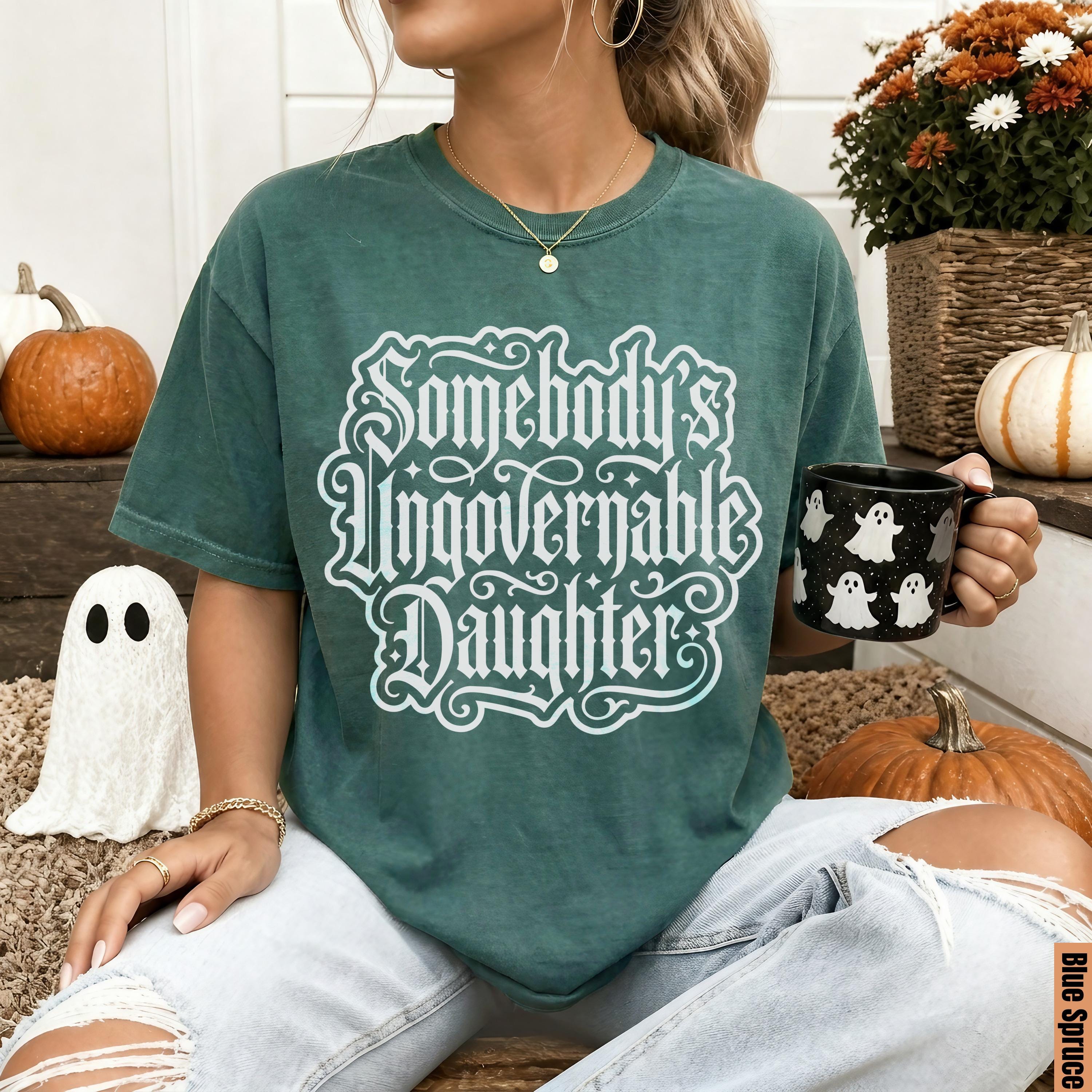 Green t-shirt with white gothic text &amp;quot;Somebody&amp;