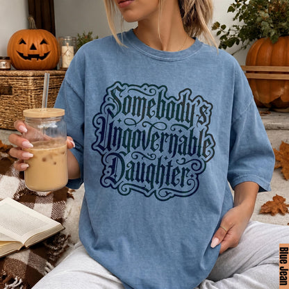 Blue Jean t-shirt with &amp;quot;Somebody Ungovernable Daughter&amp;quot; text, held by person with drink.
