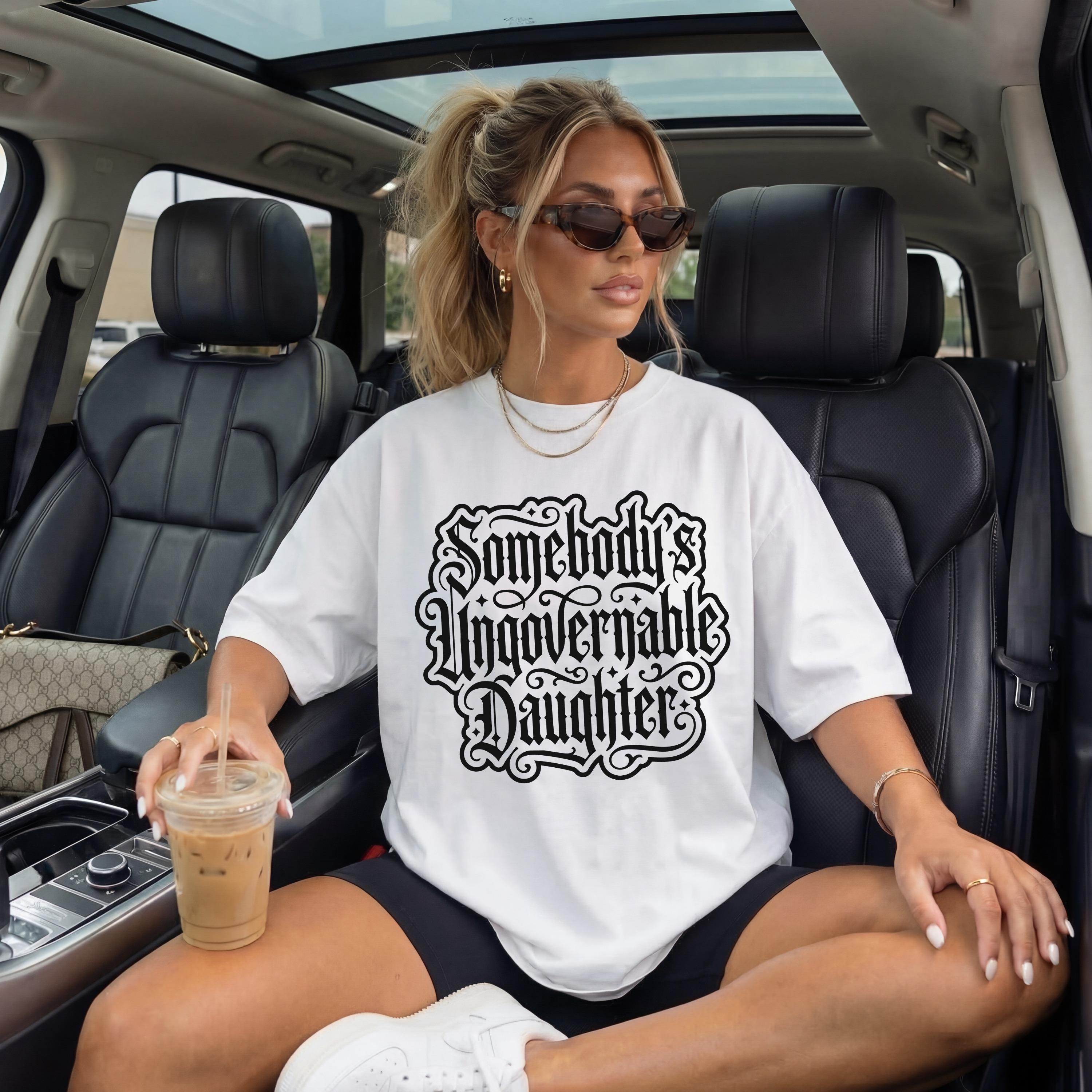 Woman in white t-shirt with &amp;quot;Somebody&amp;