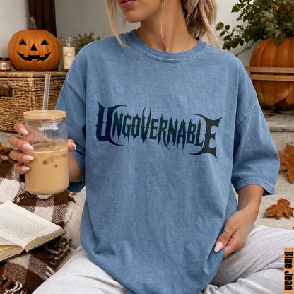 Blue Jean t-shirt with &amp;quot;Ungovernable&amp;quot; text, holding iced coffee, Halloween decor.