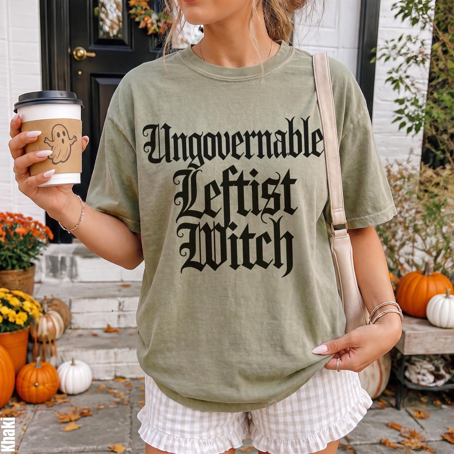 Olive green t-shirt with &amp;quot;Ungovernable Leftist Witch&amp;quot; text, holding a ghost coffee cup.