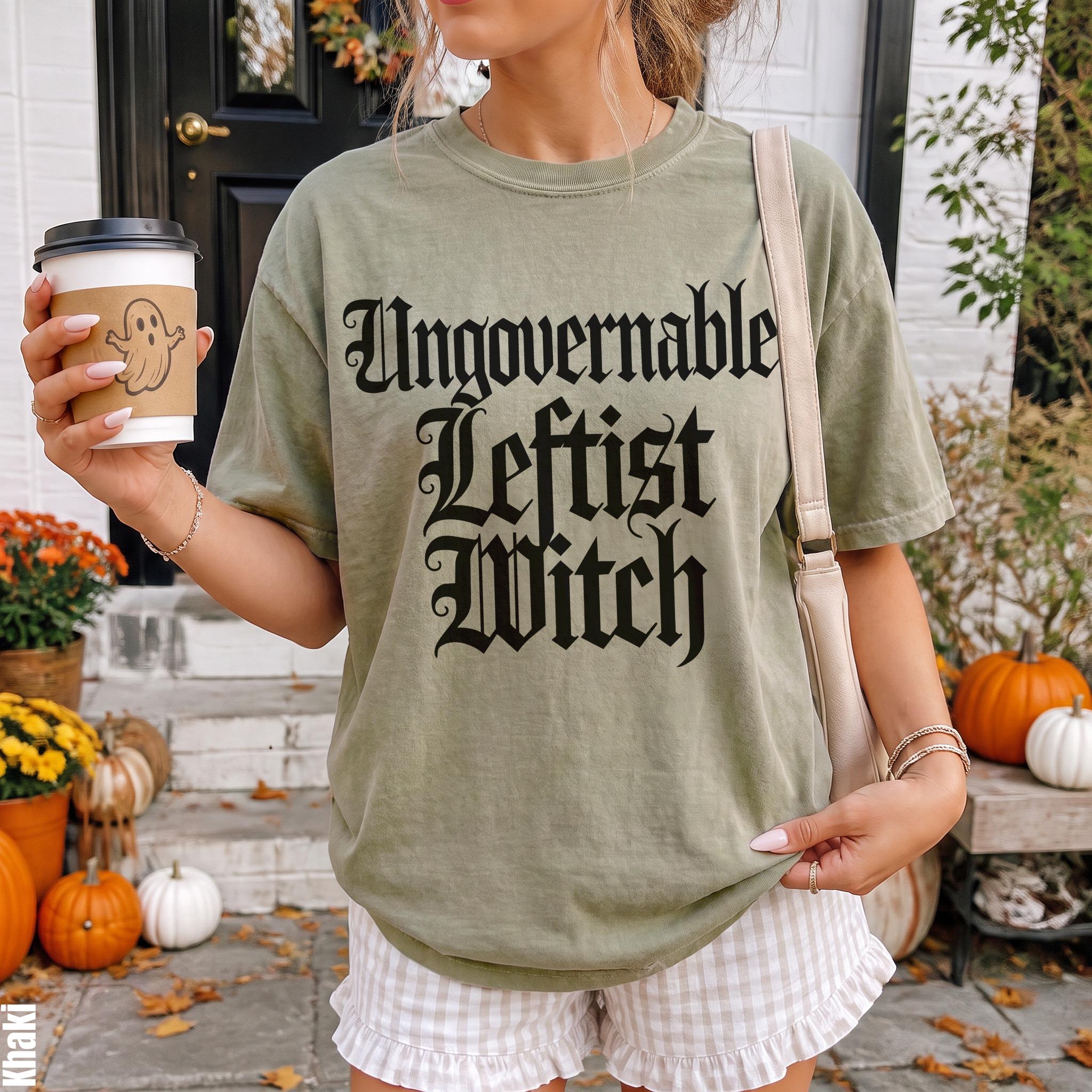Olive green t-shirt with &amp;quot;Ungovernable Leftist Witch&amp;quot; text, holding a ghost coffee cup.