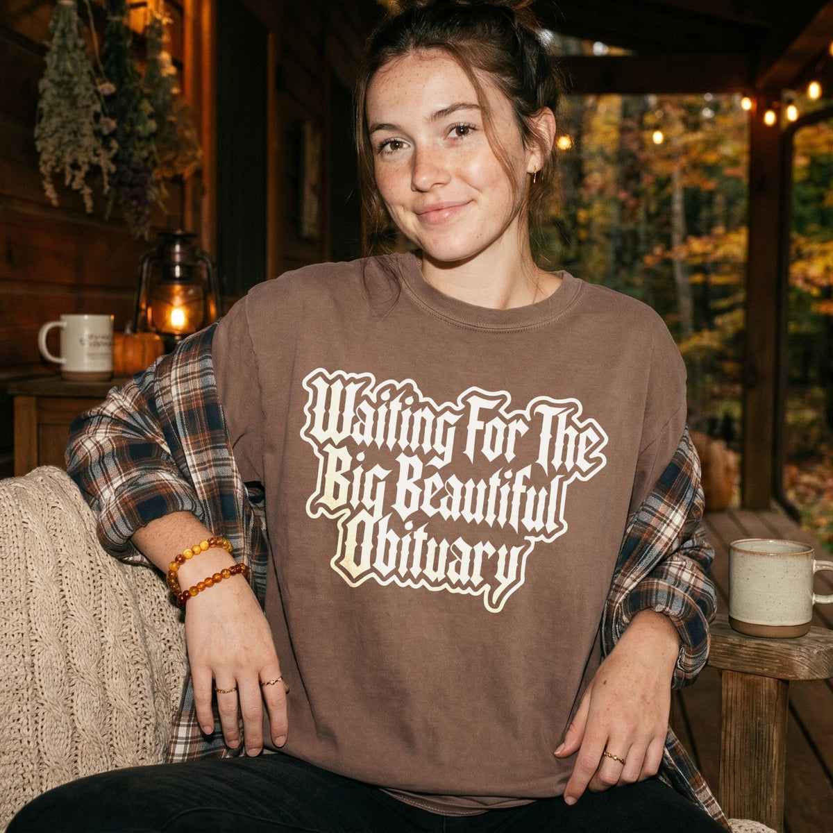 Brown t-shirt with white text reading &amp;quot;Waiting For The Big Beautiful Obituary&amp;quot;.