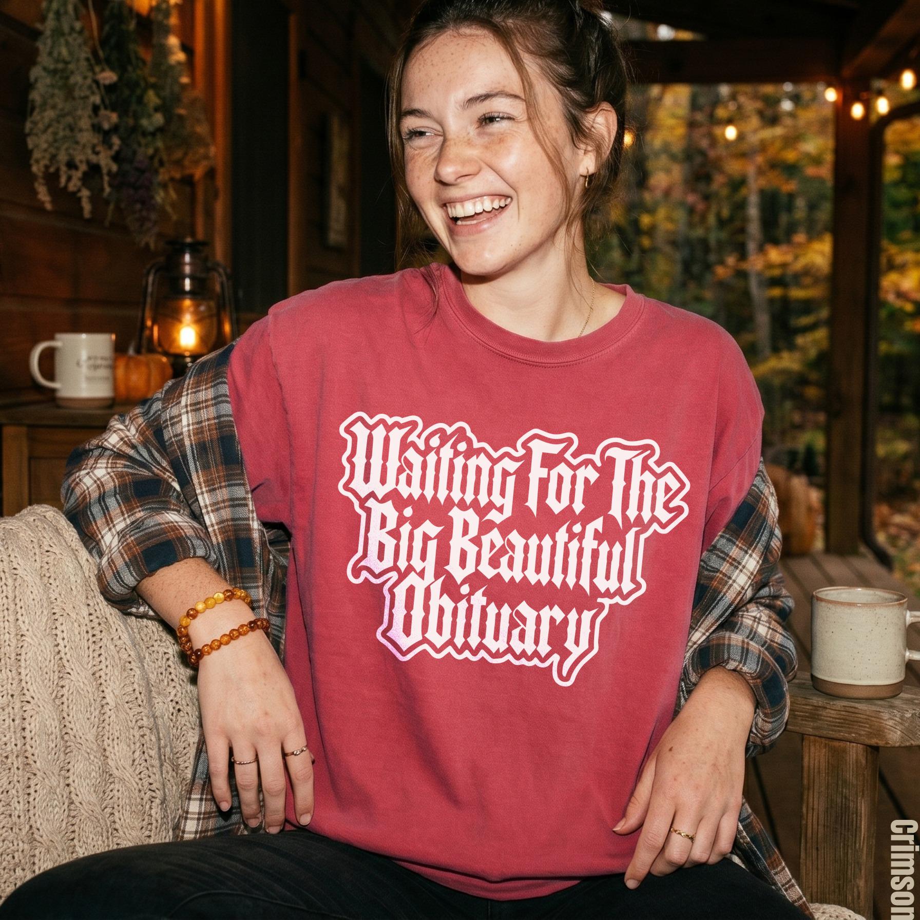 Crimson t-shirt with white gothic text &amp;quot;Waiting For The Big Beautiful Obituary&amp;quot;