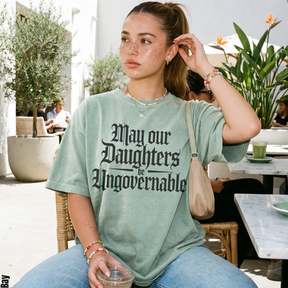 Light green t-shirt with black gothic text that reads &amp;quot;May our Daughters be Ungovernable.&amp;quot;