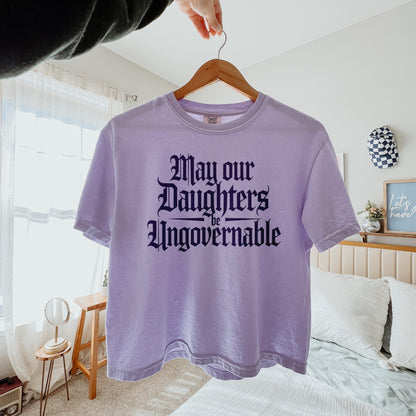 Lavender t-shirt with gothic font text &amp;quot;May our Daughters be Ungovernable&amp;quot;.