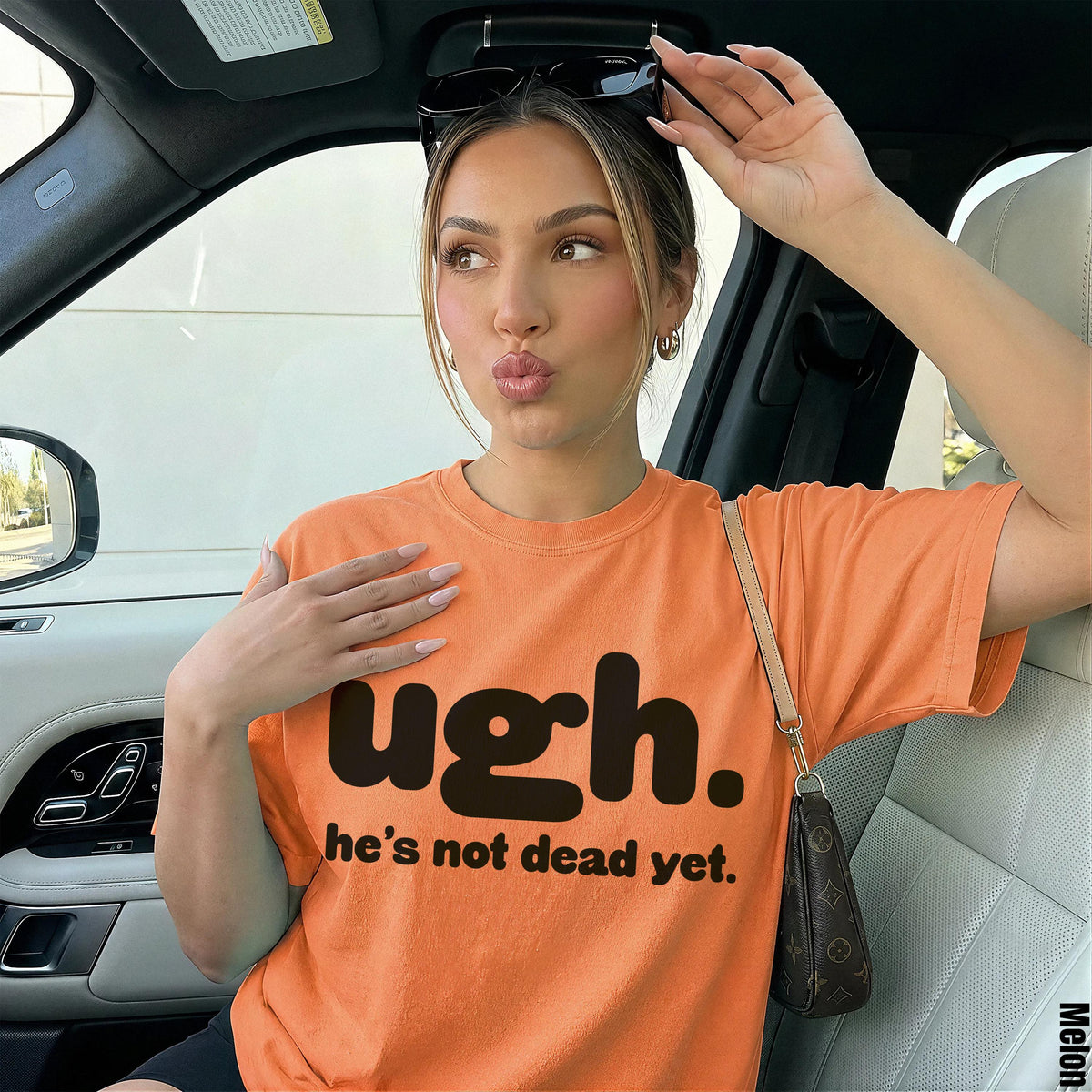 Orange t-shirt with black text &amp;quot;ugh. he&amp;
