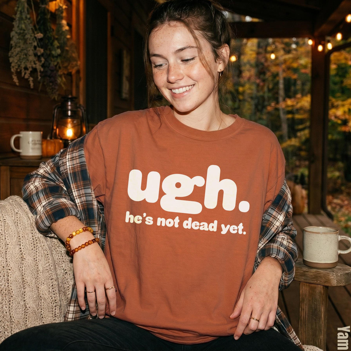 Rust-colored t-shirt with white text &amp;quot;ugh. he&amp;