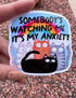 May include: A sticker with a blue background, a rainbow, and cartoon cats. The text reads "SOMEBODY&