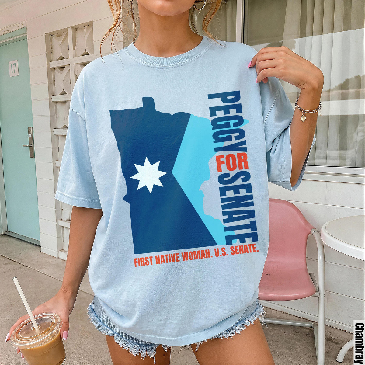 Light blue t-shirt with Peggy for Senate, First Native Woman U.S. Senate graphic.