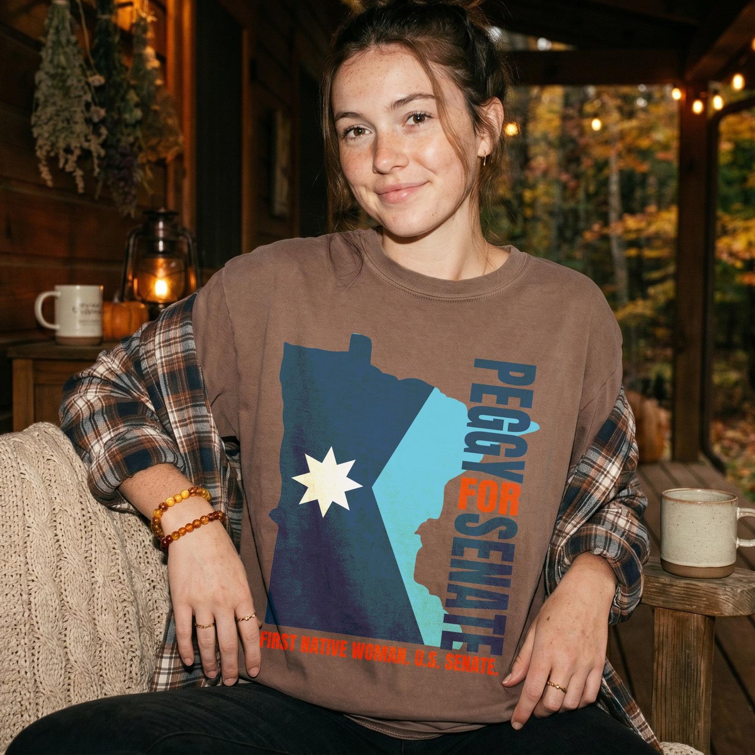 Brown t-shirt with Minnesota outline, &amp;quot;Peggy for Senate,&amp;quot; and &amp;quot;First Native Woman U.S. Senate.&amp;quot;