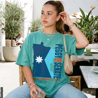Teal t-shirt with &amp;quot;Peggy for Senate&amp;quot; and &amp;quot;First Native Woman, U.S. Senate&amp;quot; text.