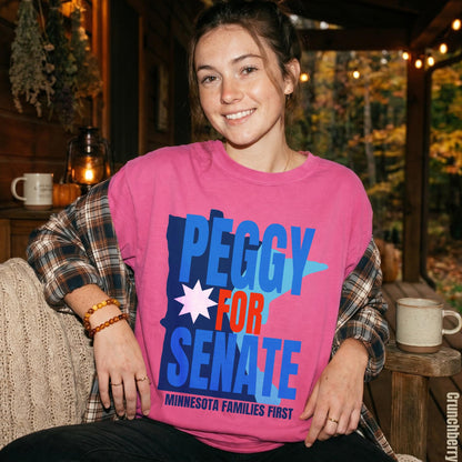 Woman in pink t-shirt with &amp;quot;PEGGY FOR SENATE MINNESOTA FAMILIES FIRST&amp;quot; text.