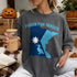 Dark t-shirt with "Peggy for Senate Minnesota" and state outline with loon.