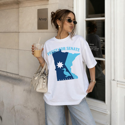 Woman wearing a white t-shirt with &amp;quot;Peggy for Senate Minnesota&amp;quot; graphic and holding a coffee.