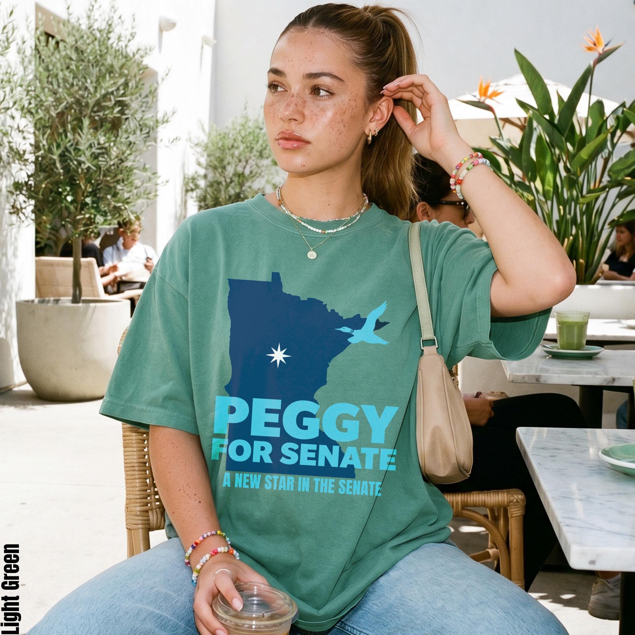 Green t-shirt with &amp;quot;Peggy For Senate A New Star in the Senate&amp;quot; text and state graphic.