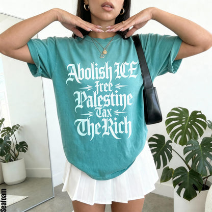 Teal t-shirt with white text reading &amp;quot;Abolish ICE, Free Palestine, Tax The Rich&amp;quot;.
