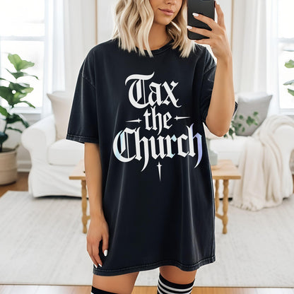 Black t-shirt with white text &amp;quot;Tax the Church&amp;quot; and a cross symbol.