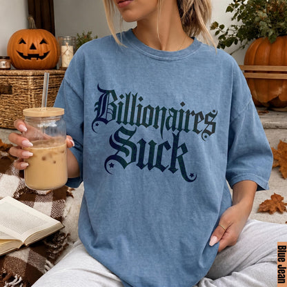 Blue t-shirt with &amp;quot;Billionaires Suck&amp;quot; in gothic font, holding iced coffee.
