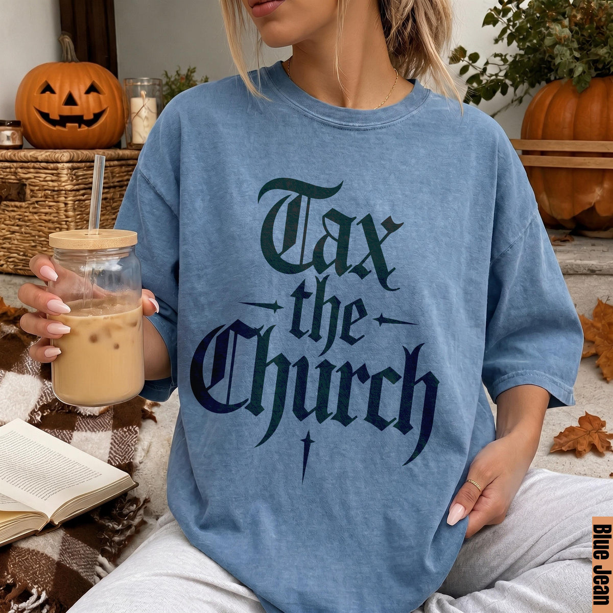 Blue t-shirt with gothic font text &amp;quot;Tax the Church&amp;quot;.