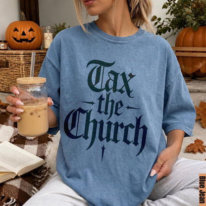 Blue t-shirt with gothic font text &amp;quot;Tax the Church&amp;quot;.