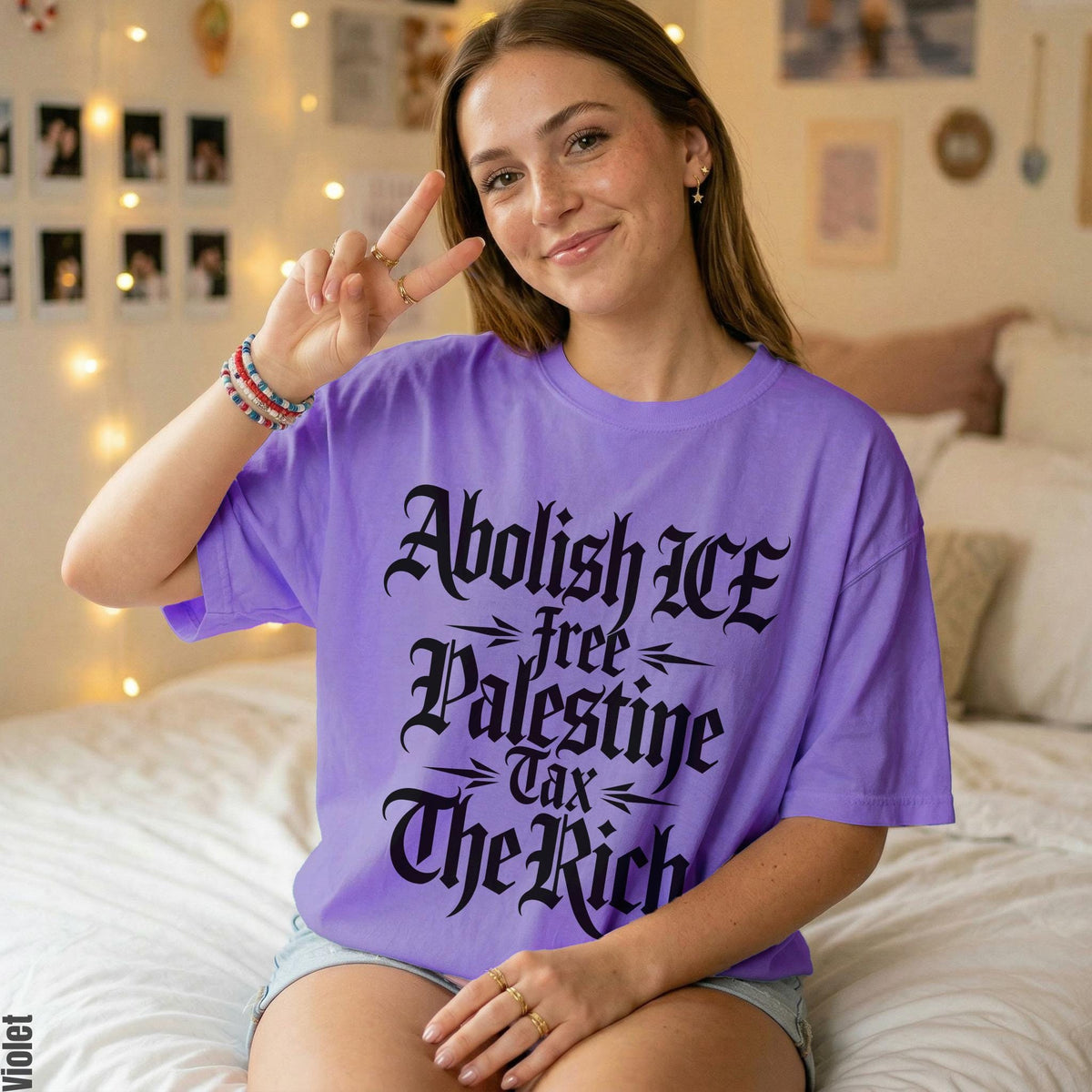 Purple t-shirt with text: Abolish ICE, Free Palestine, Tax The Rich.