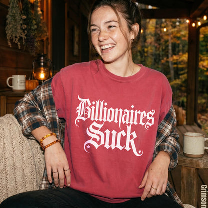 Red t-shirt with white gothic text &amp;quot;Billionaires Suck&amp;quot;.