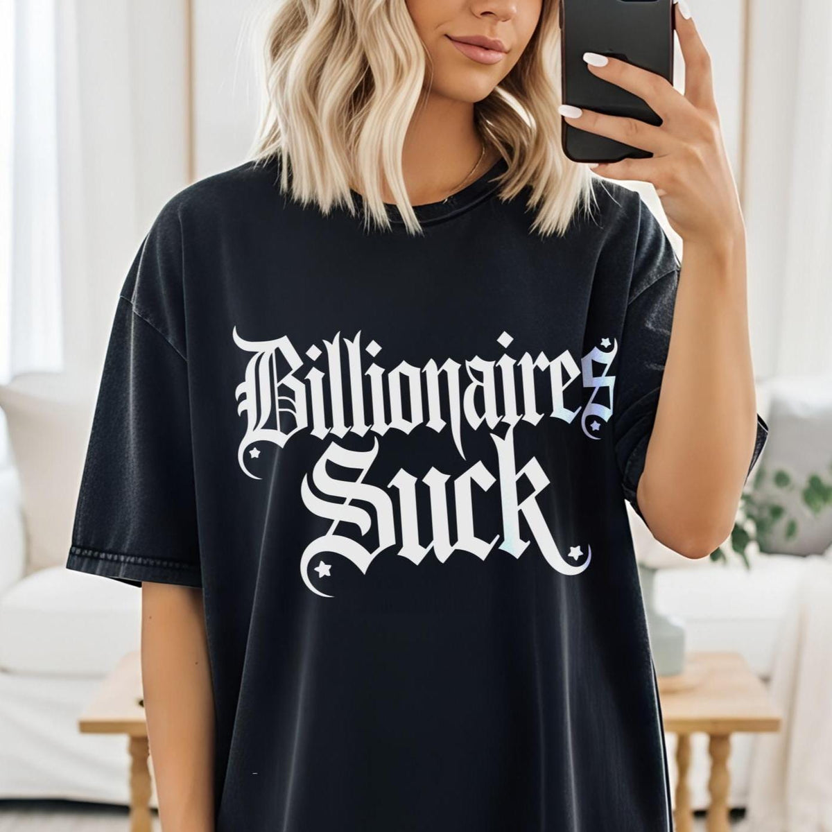 Black t-shirt with white gothic text that reads &amp;quot;Billionaires Suck&amp;quot;.