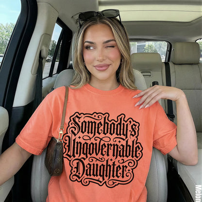 Orange t-shirt with black text reading &amp;quot;Somebody&amp;
