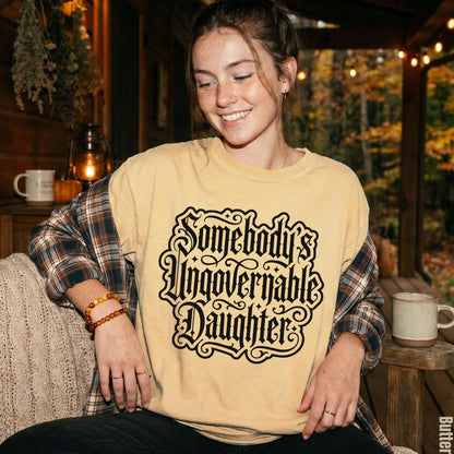 Woman wearing a yellow t-shirt with &amp;quot;Somebody&amp;