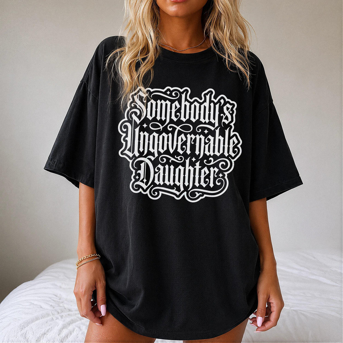 Black t-shirt with white text reading &amp;quot;Somebody&amp;