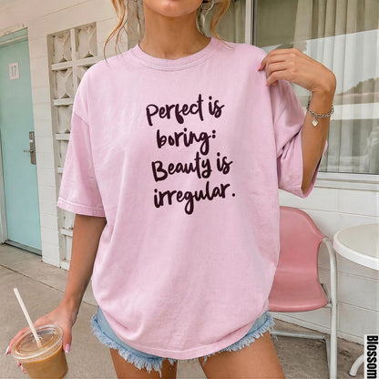 Pink t-shirt with text &amp;quot;Perfect is boring: Beauty is irregular.&amp;quot;