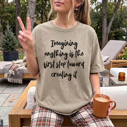 T-shirt with text &amp;quot;Imagining anything is the first step toward creating it&amp;quot;.