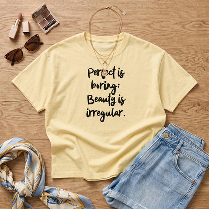 Yellow t-shirt with text &amp;quot;Perfect is boring: Beauty is irregular.&amp;quot;