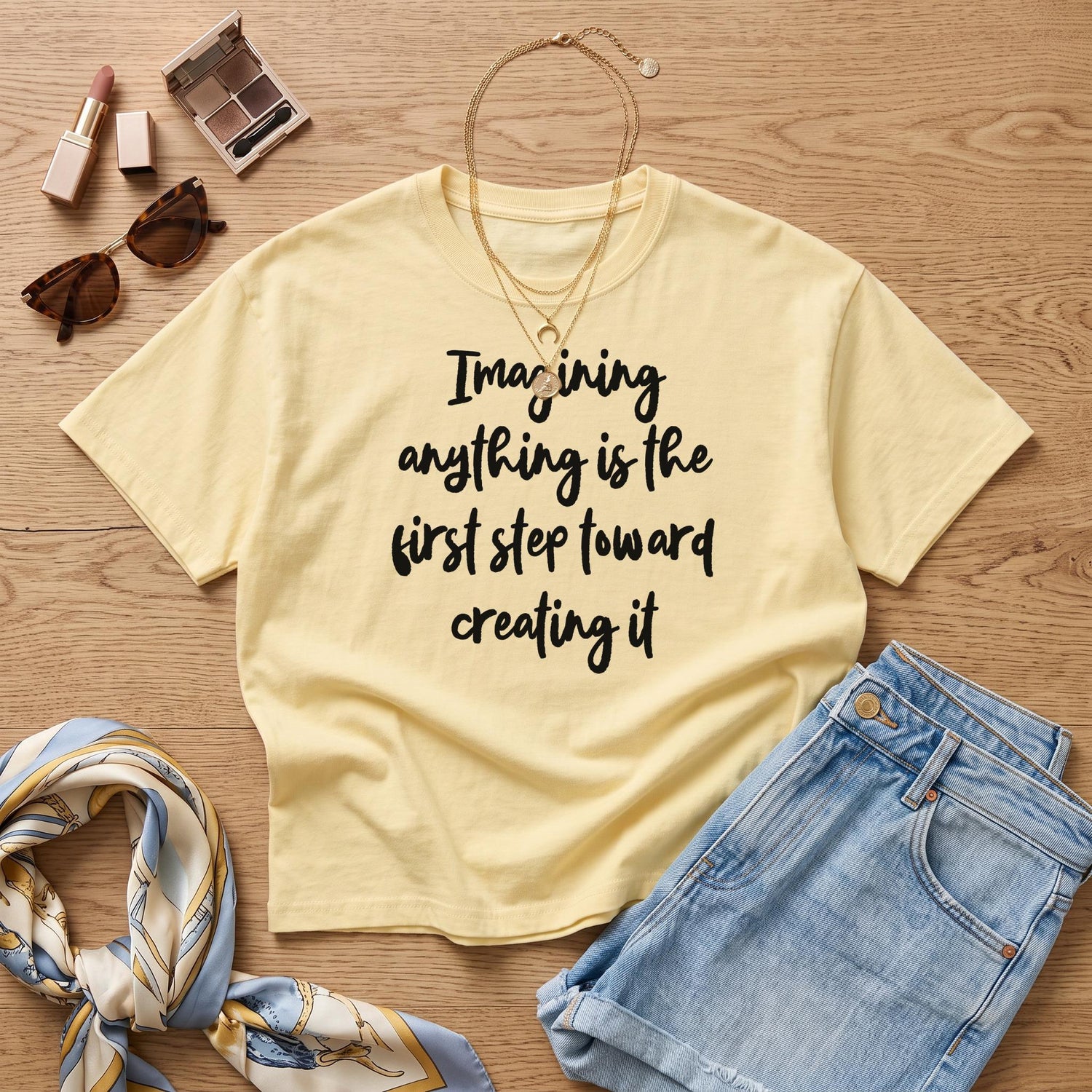 Yellow t-shirt with black text: &amp;quot;Imagining anything is the first step toward creating it.&amp;quot;