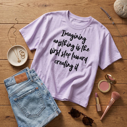 Lavender t-shirt with text &amp;quot;Imagining anything is the first step toward creating it&amp;quot;.