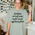 Light green t-shirt with black text: "Decisions are best made by the people affected by them."
