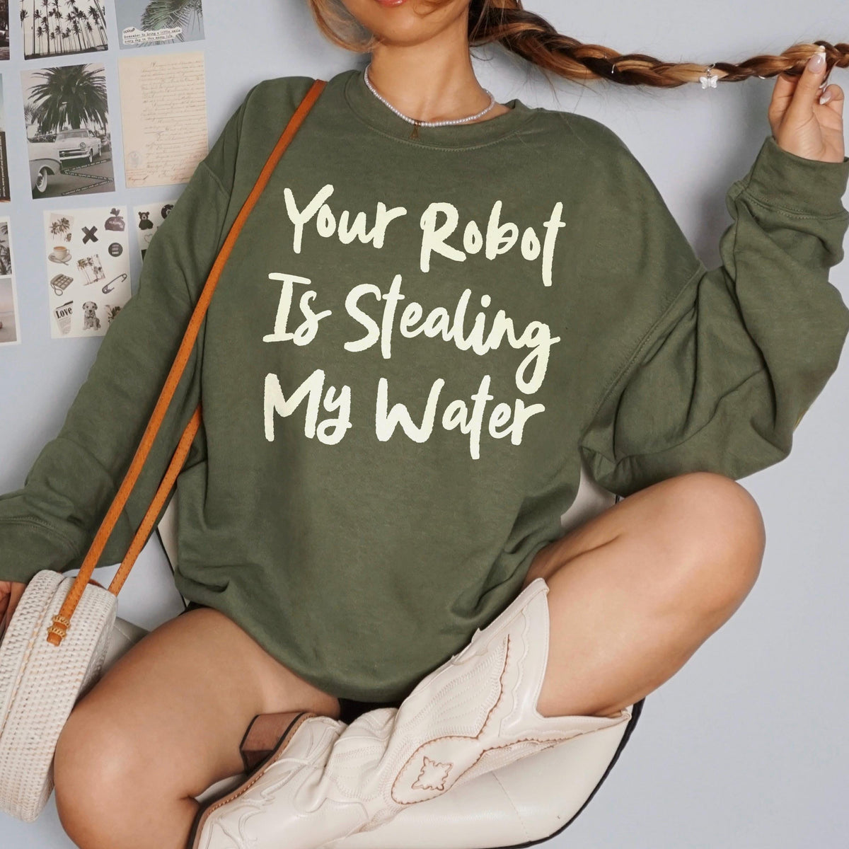 Olive sweatshirt with white text &amp;quot;Your Robot Is Stealing My Water&amp;quot;.