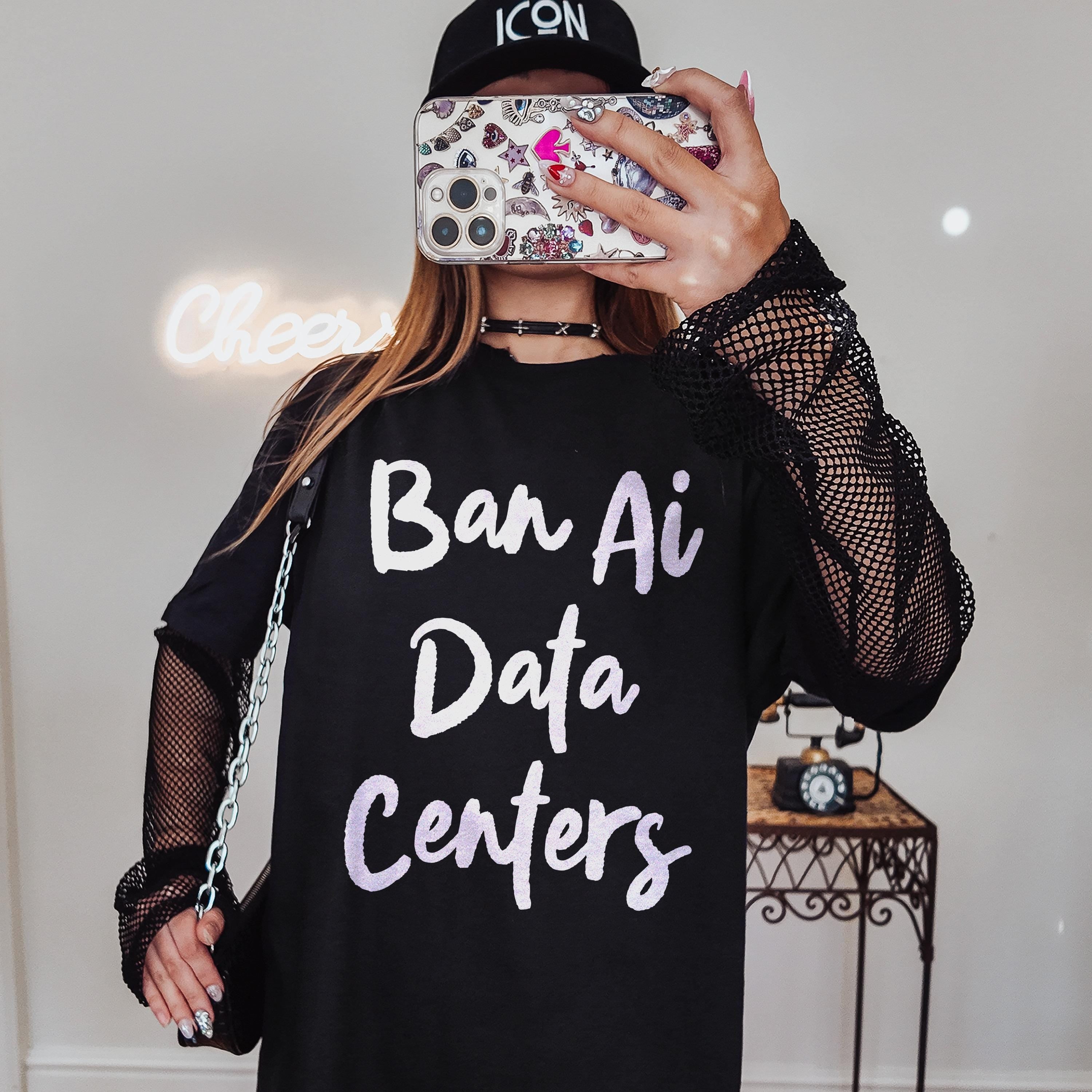 Black t-shirt with &amp;quot;Ban Ai Data Centers&amp;quot; text, fishnet sleeves, and a chain purse.