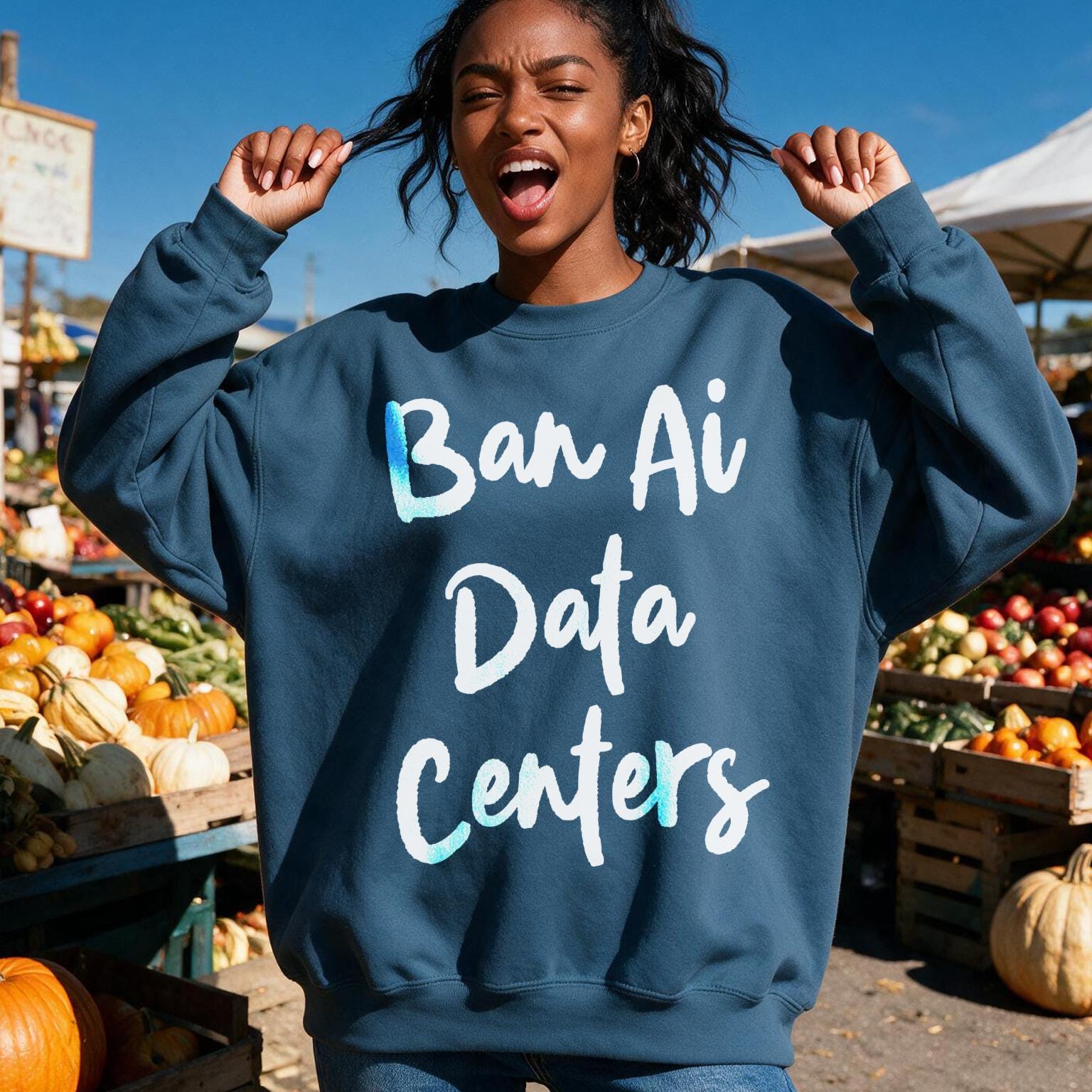 Woman wearing a navy sweatshirt with &amp;quot;Ban Ai Data Centers&amp;quot; text in white cursive.