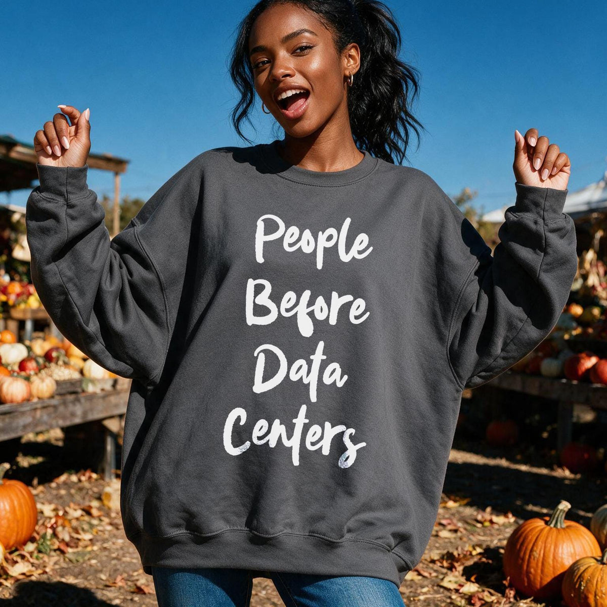 Dark gray sweatshirt with white text &amp;quot;People Before Data Centers&amp;quot;.