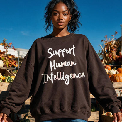Brown sweatshirt with &amp;quot;Support Human Intelligence&amp;quot; text in white and pink.
