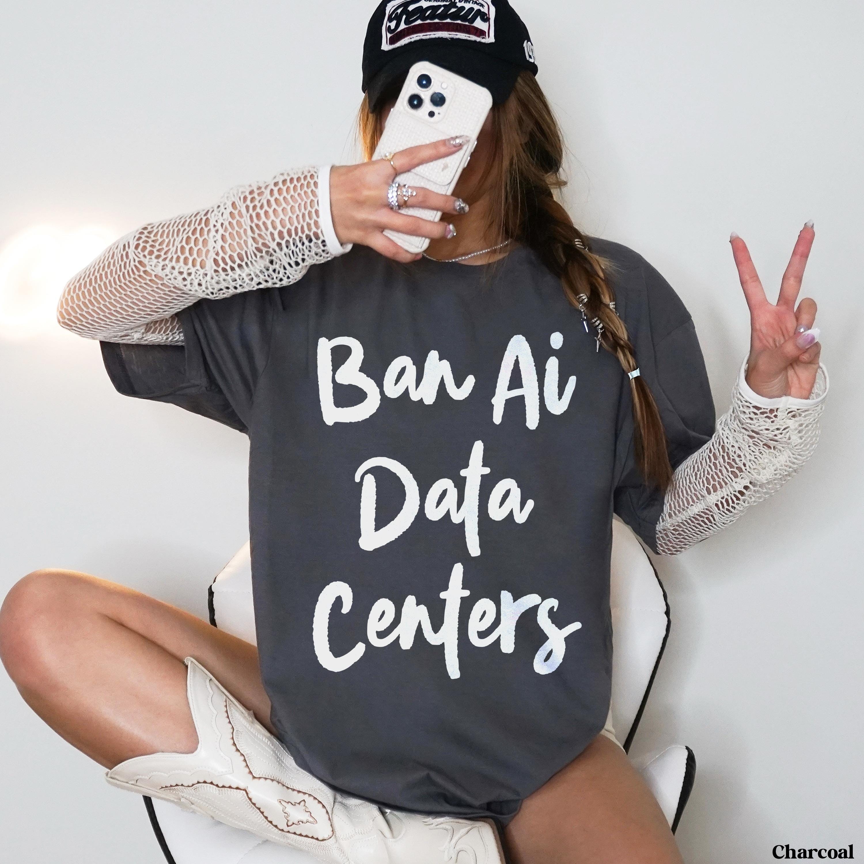 Charcoal t-shirt with white text &amp;quot;Ban Ai Data Centers&amp;quot; worn by a person taking a selfie.