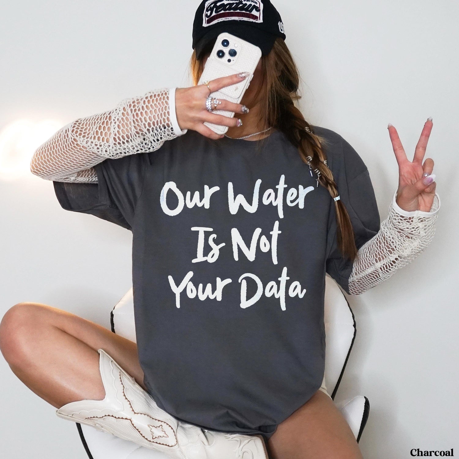 Charcoal grey t-shirt with white text &amp;quot;Our Water Is Not Your Data&amp;quot;.